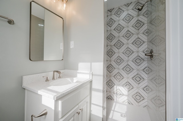 bathroom with vanity and a shower