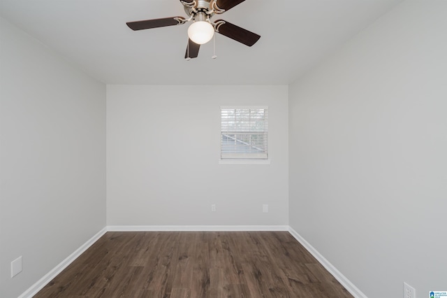 empty room featuring ceiling fan and dark hardwood / wood-style floors