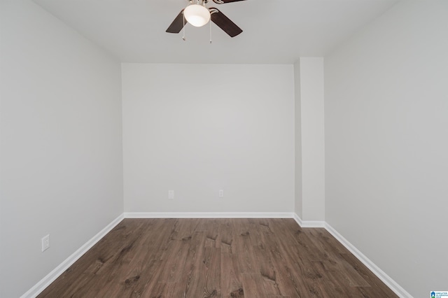 spare room with ceiling fan and dark hardwood / wood-style floors