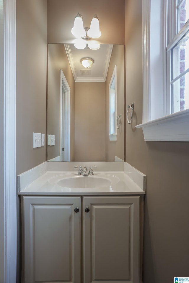 bathroom featuring crown molding and vanity