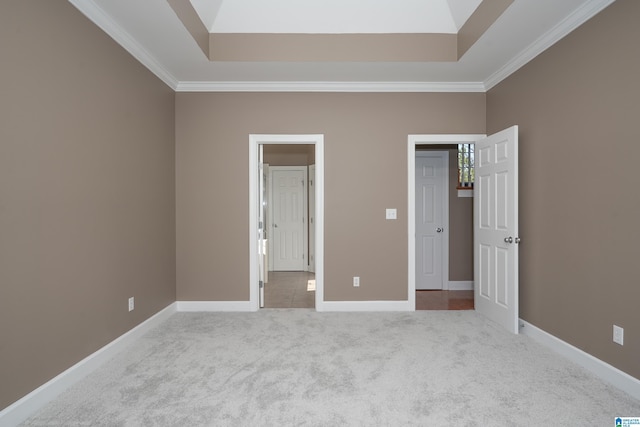 unfurnished bedroom with crown molding and light carpet