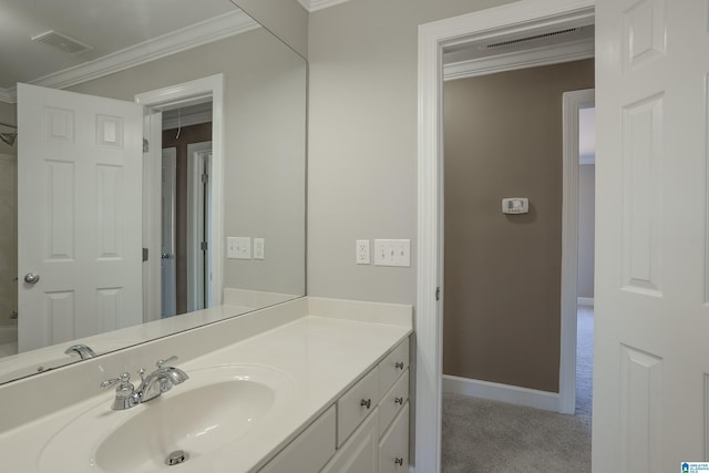 bathroom with vanity and ornamental molding