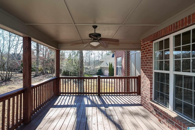 wooden terrace featuring ceiling fan