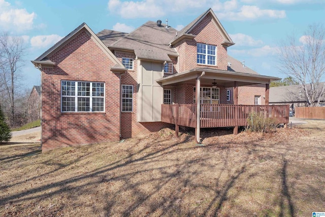 view of front of property with ceiling fan and a deck