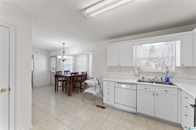 kitchen with white cabinetry, sink, white dishwasher, and pendant lighting