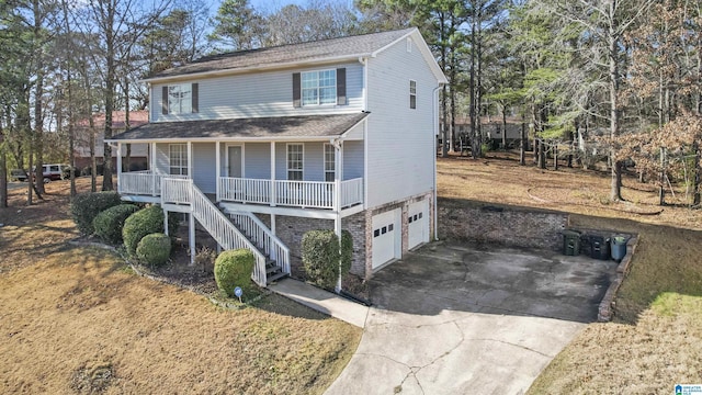 view of front of house featuring a garage and covered porch