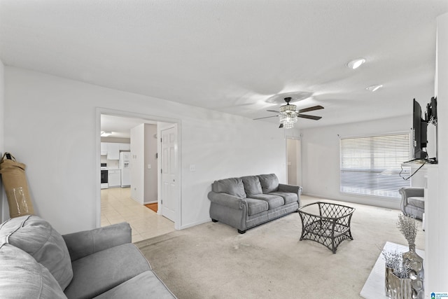 living room featuring ceiling fan and light carpet