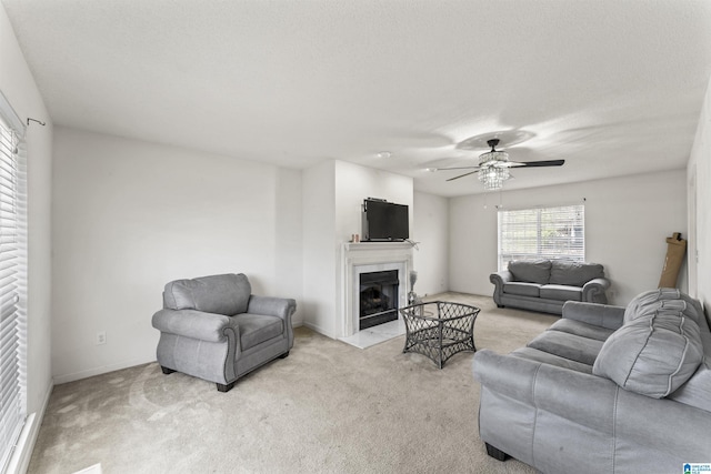 living room featuring light carpet and ceiling fan