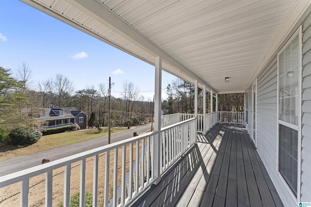 wooden terrace featuring a porch