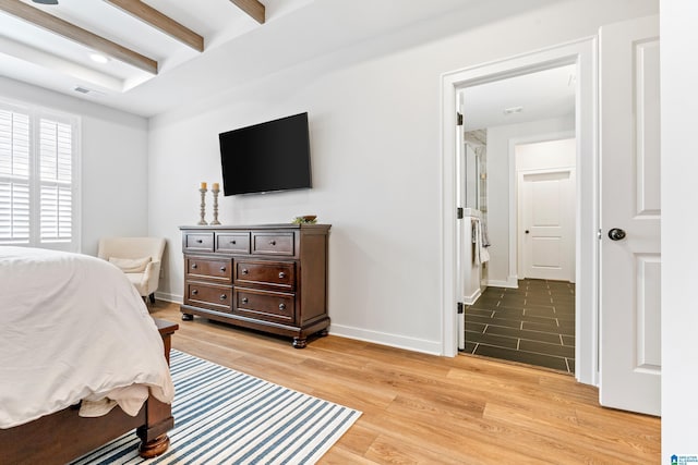 bedroom with beam ceiling