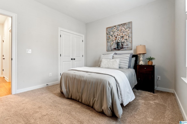 bedroom with carpet floors and a closet