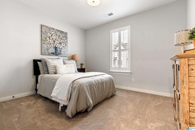 bedroom featuring light carpet