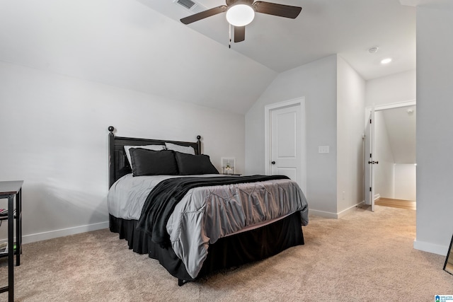 bedroom featuring light carpet, vaulted ceiling, and ceiling fan