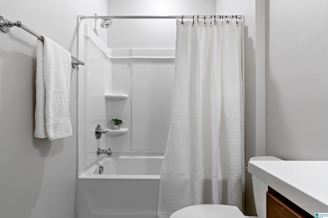 full bathroom with shower / bath combination with curtain, vanity, and toilet