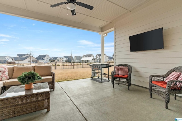 view of patio with outdoor lounge area and ceiling fan