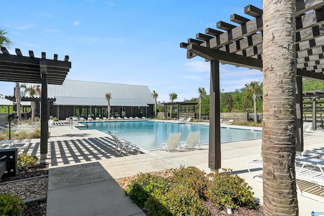 view of pool with a pergola and a patio area