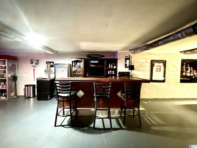 bar with concrete flooring