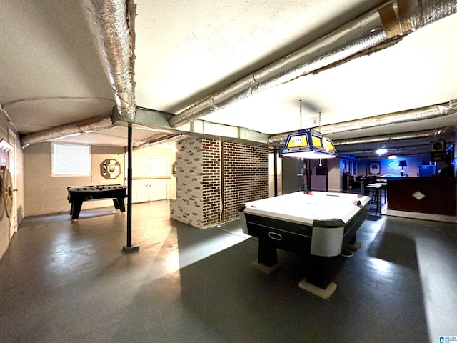 rec room with concrete flooring and pool table