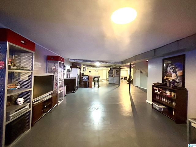 basement featuring white fridge