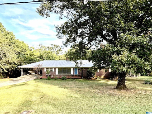 single story home featuring a front yard and a carport