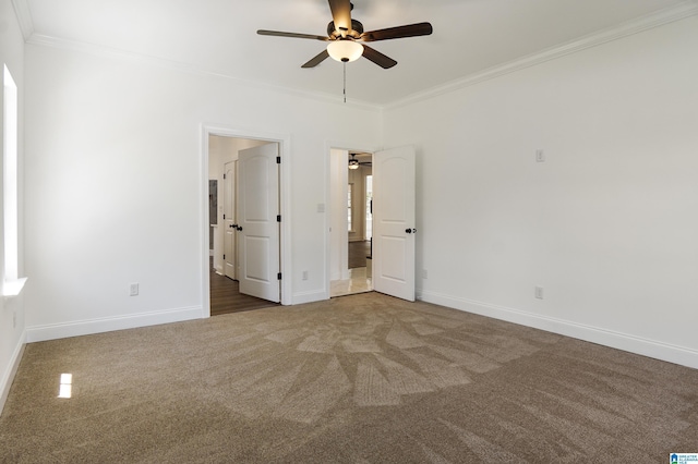 unfurnished bedroom with carpet, ceiling fan, and crown molding