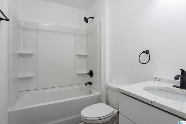 full bathroom featuring shower / bathing tub combination, vanity, and toilet