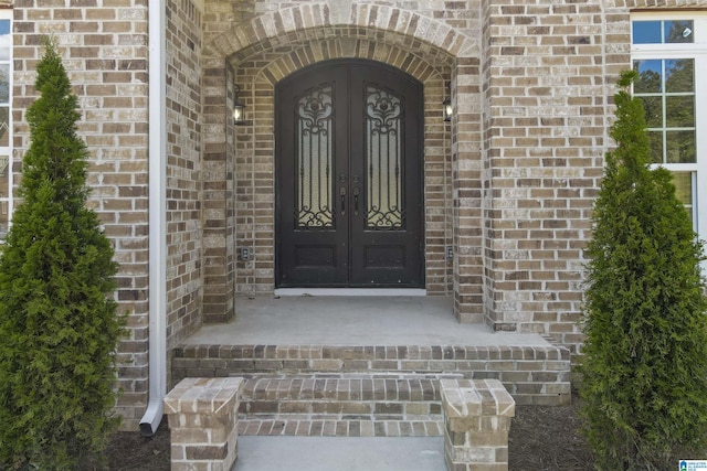 entrance to property featuring french doors