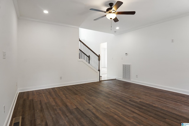 unfurnished living room featuring dark hardwood / wood-style floors, ceiling fan, and crown molding