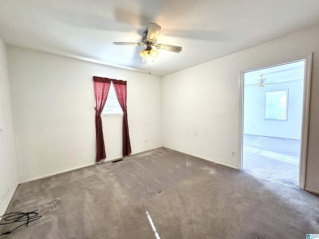 unfurnished room with carpet flooring and ceiling fan