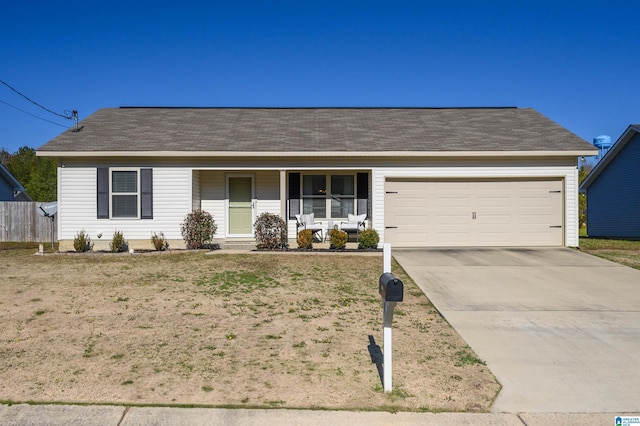 ranch-style house featuring a garage and covered porch