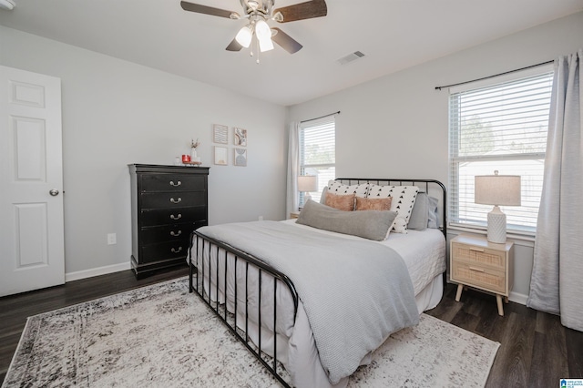 bedroom featuring ceiling fan and dark wood-type flooring