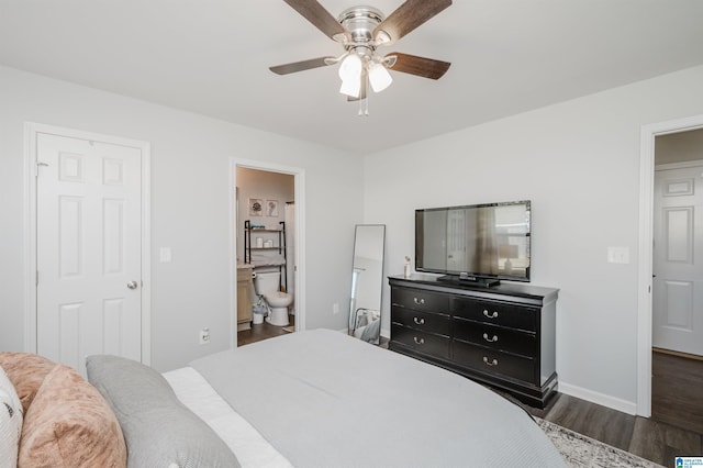 bedroom featuring ensuite bath, ceiling fan, and dark hardwood / wood-style floors