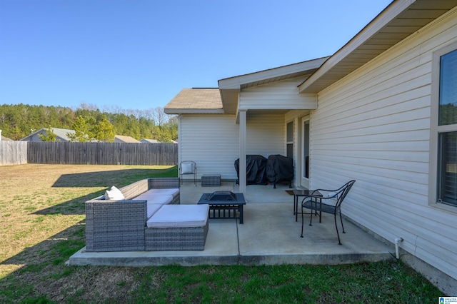 view of patio featuring grilling area and an outdoor living space with a fire pit