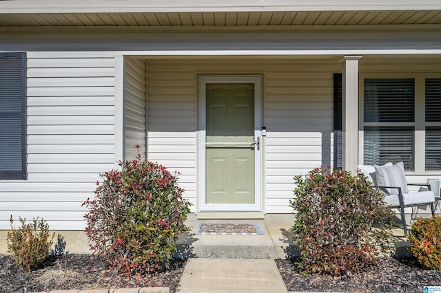 doorway to property with a porch