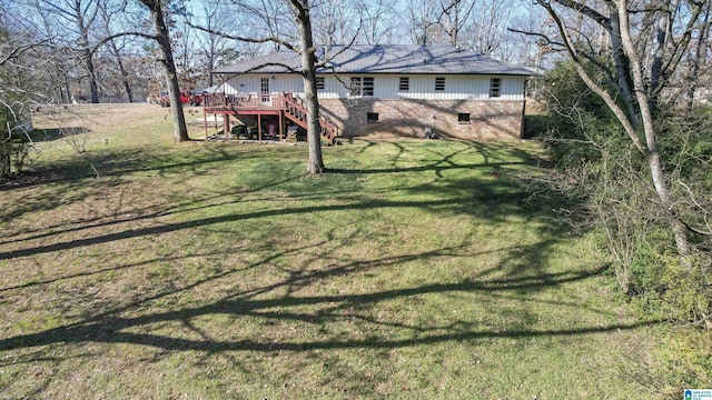 view of yard featuring a wooden deck