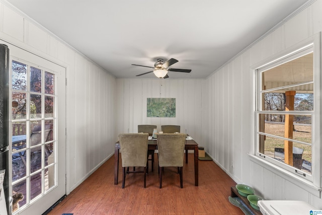 dining room with hardwood / wood-style flooring and ceiling fan