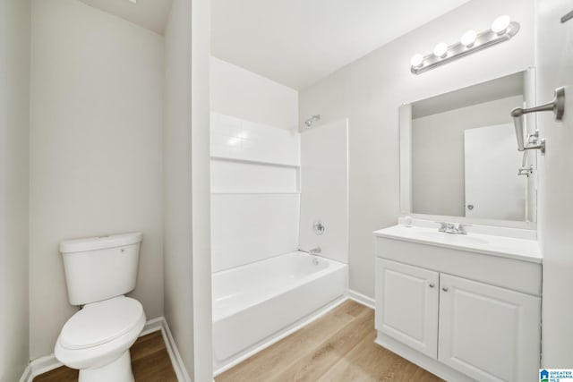 full bathroom with shower / tub combination, hardwood / wood-style flooring, vanity, and toilet