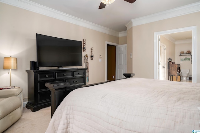 bedroom with ceiling fan, light colored carpet, crown molding, and connected bathroom