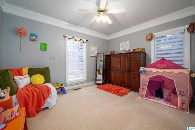 carpeted bedroom featuring ceiling fan and ornamental molding