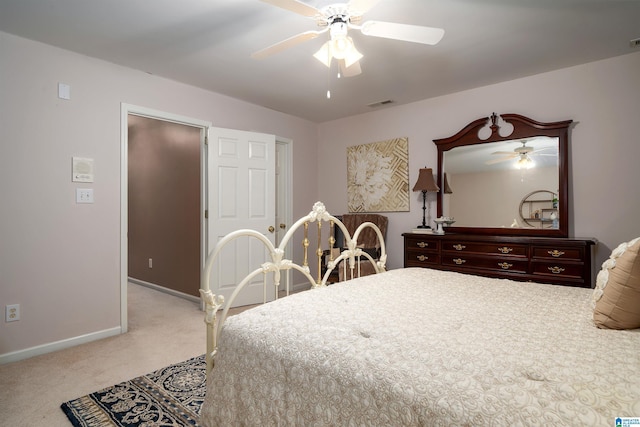 bedroom with ceiling fan and light colored carpet