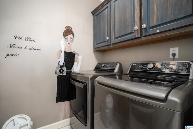 washroom with separate washer and dryer, tile patterned flooring, and cabinets