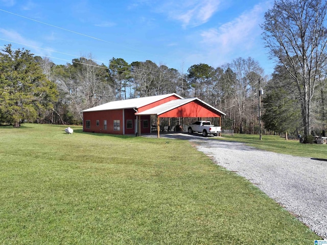 exterior space featuring a front lawn and a carport