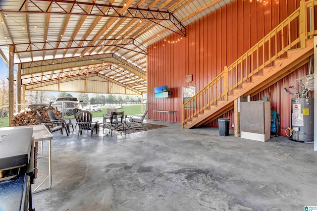 interior space featuring wood walls and gas water heater