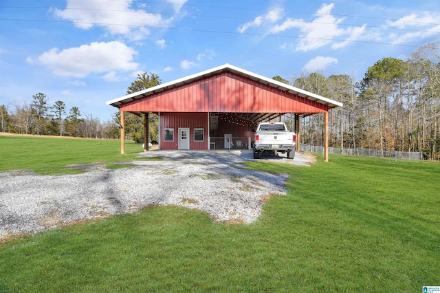 garage with a lawn and a carport