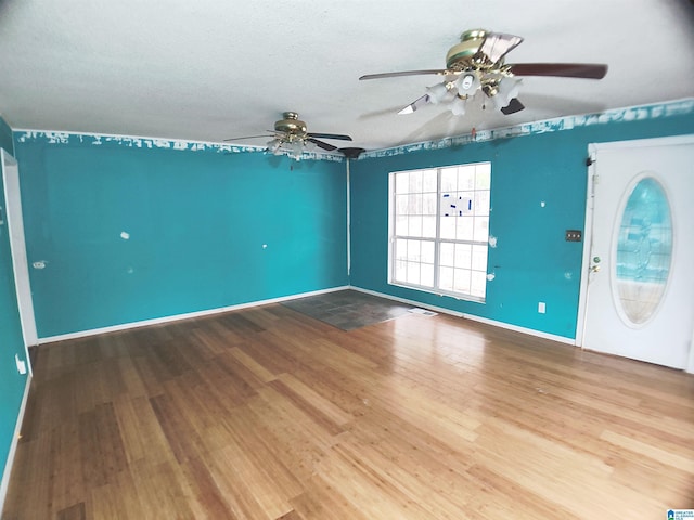 55 Jeter Rd, Talladega, AL 35160 - foyer featuring wood-type flooring, a textured ceiling, and ceiling fan