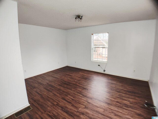 55 Jeter Rd, Talladega, AL 35160 - spare room featuring dark wood-type flooring