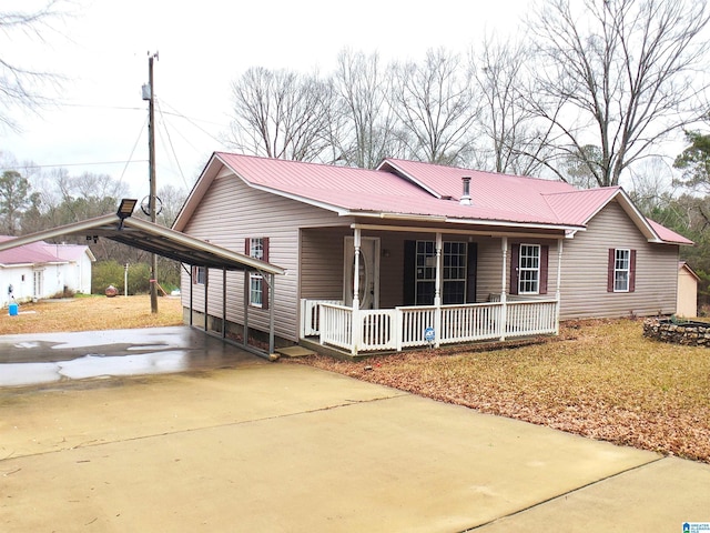 view of front of house with a porch and a carport