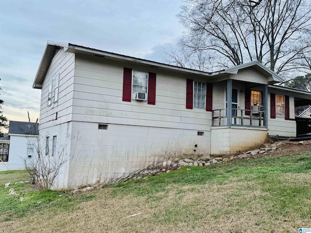 view of front of property with cooling unit and a front yard