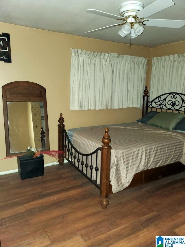 bedroom with ceiling fan and hardwood / wood-style floors