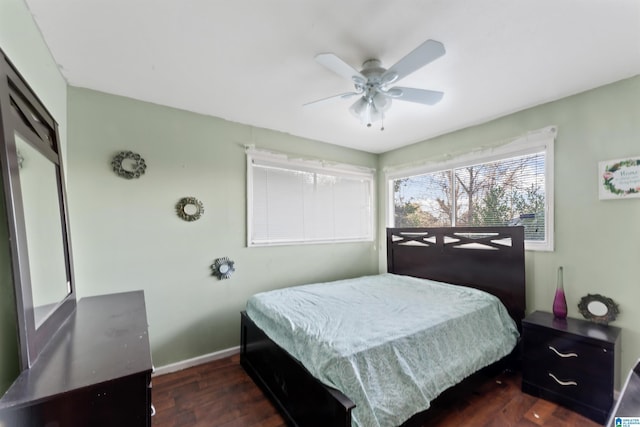 bedroom featuring ceiling fan and dark hardwood / wood-style flooring